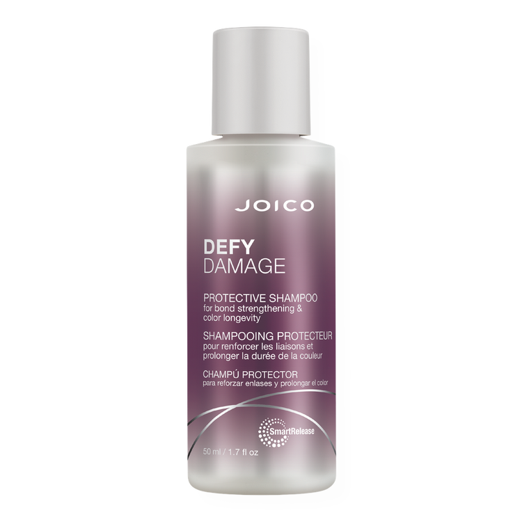 Travel Size Defy Damage Protective Shampoo limpia las impurezas